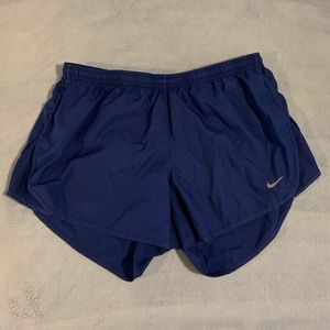 Blue Nike running shorts